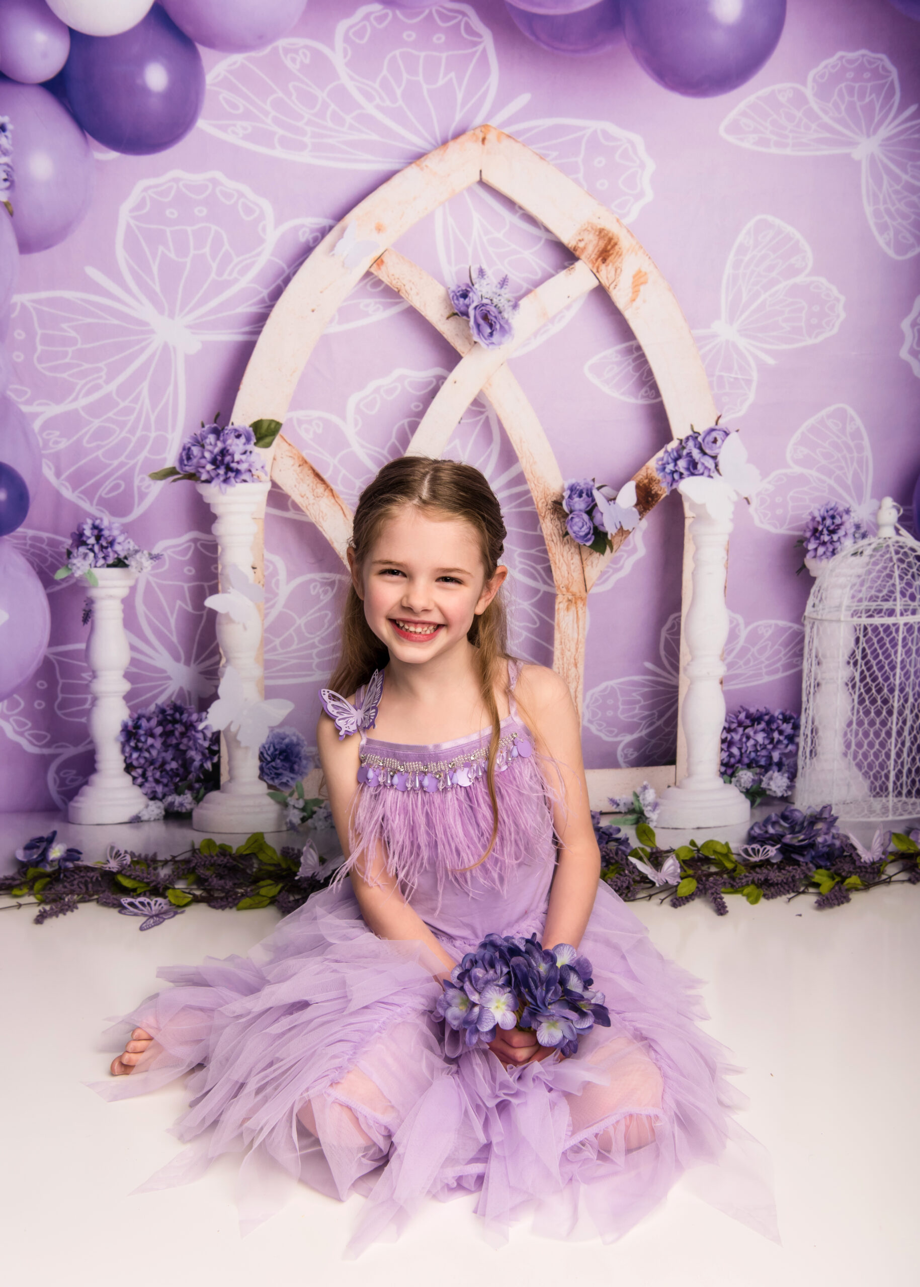 young girl in purple dress sitting in front of a castle indoor activities in waco
